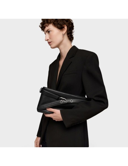 Clutch negro piel TOUS Hold | bolso de mano elegante y versátil